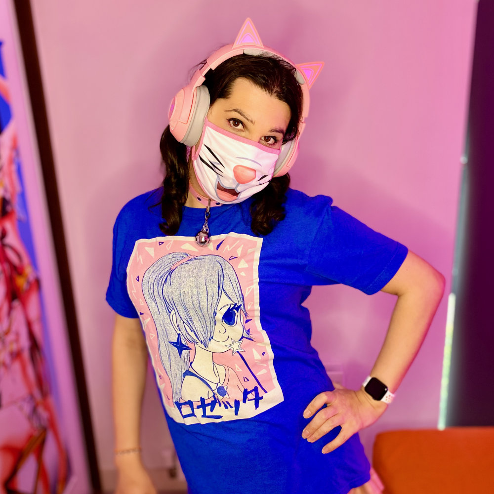 Rina wearing a blue & pink anime tshirt, pink skirt, pink & blue tights, and pink cat ear headphones