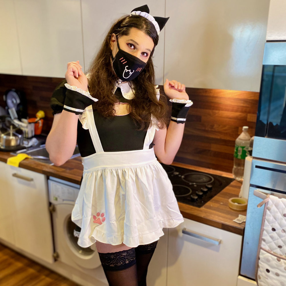 Rina dressed in a cute French maid costume, with cat paw details and cat ears