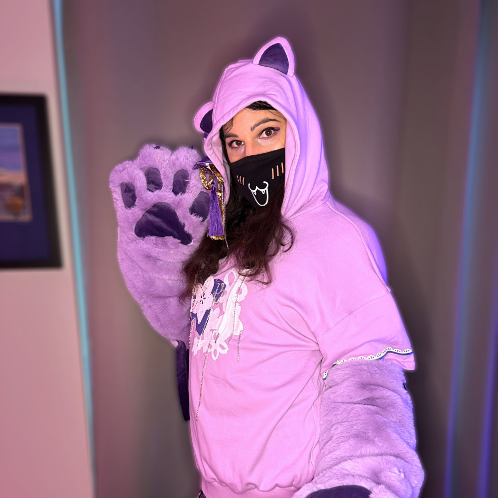 Rina wearing a purple hoodie with cat ears, and big, fluffy paws